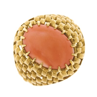 Lot 125 - A 1970s 18ct gold coral cabochon dress ring,...