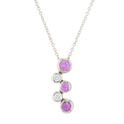 Lot 142 - Tiffany & Co., a platinum pink sapphire and...