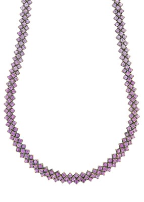 Lot 157 - An 18ct gold pink sapphire three-row...