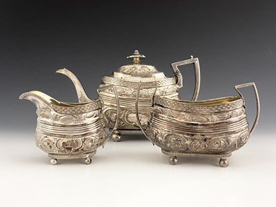 Lot 85 - A George III Provincial silver three-piece tea...