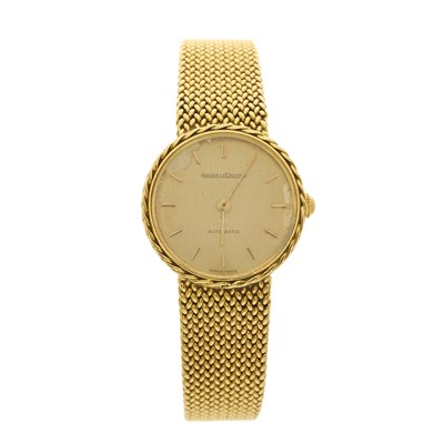 Lot 228 - Jaeger-LeCoultre, an 18ct gold bracelet watch,...