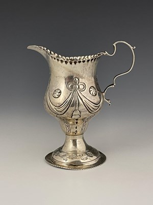 Lot 127 - A George III silver milk jug, double ogee...