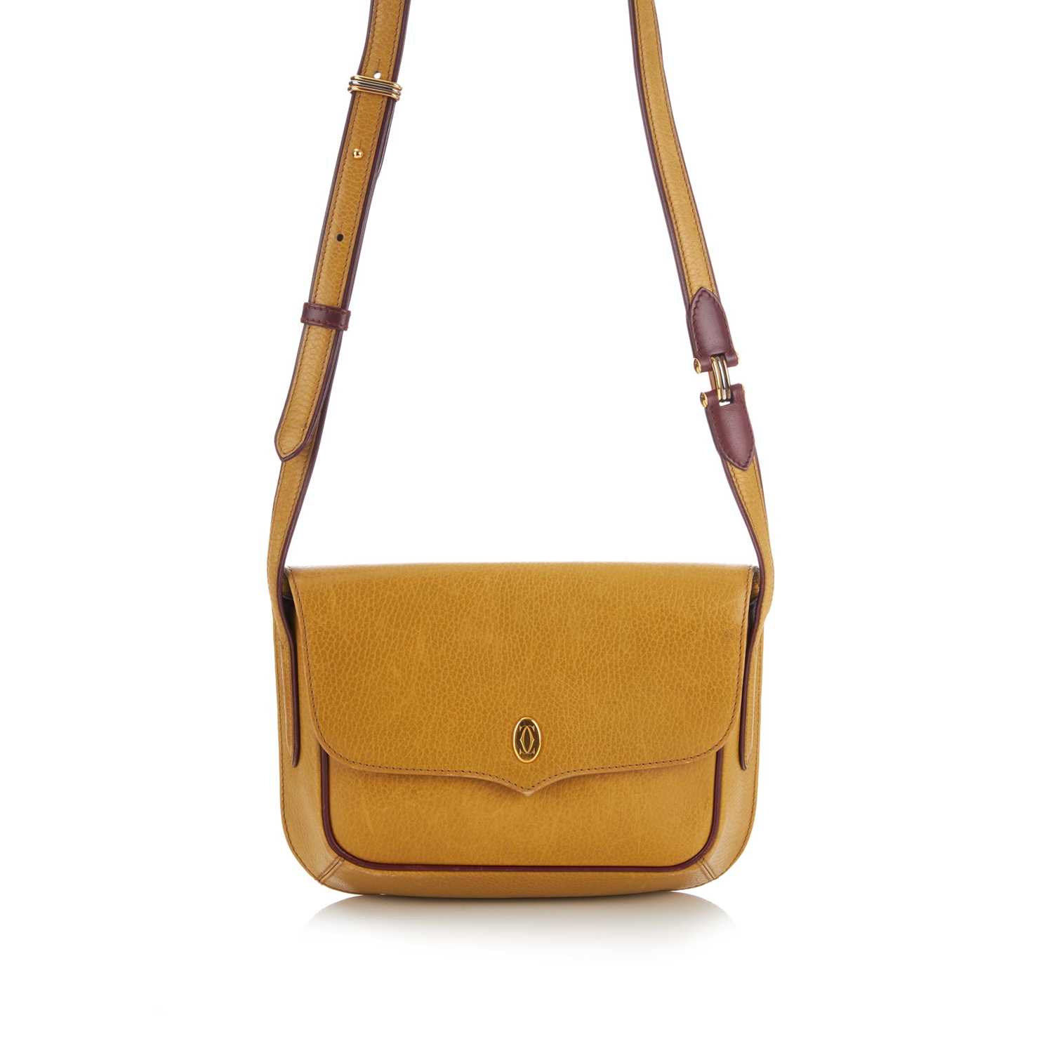 Lot 273 - Cartier, a Must De Cartier crossbody flap...