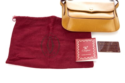 Lot 273 - Cartier, a Must De Cartier crossbody flap...