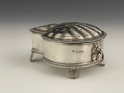 Lot 128 - A George V silver inkwell, modelled after a...