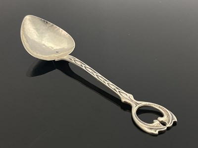 Lot 73 - A E Jones, an Arts and Crafts silver spoon,...