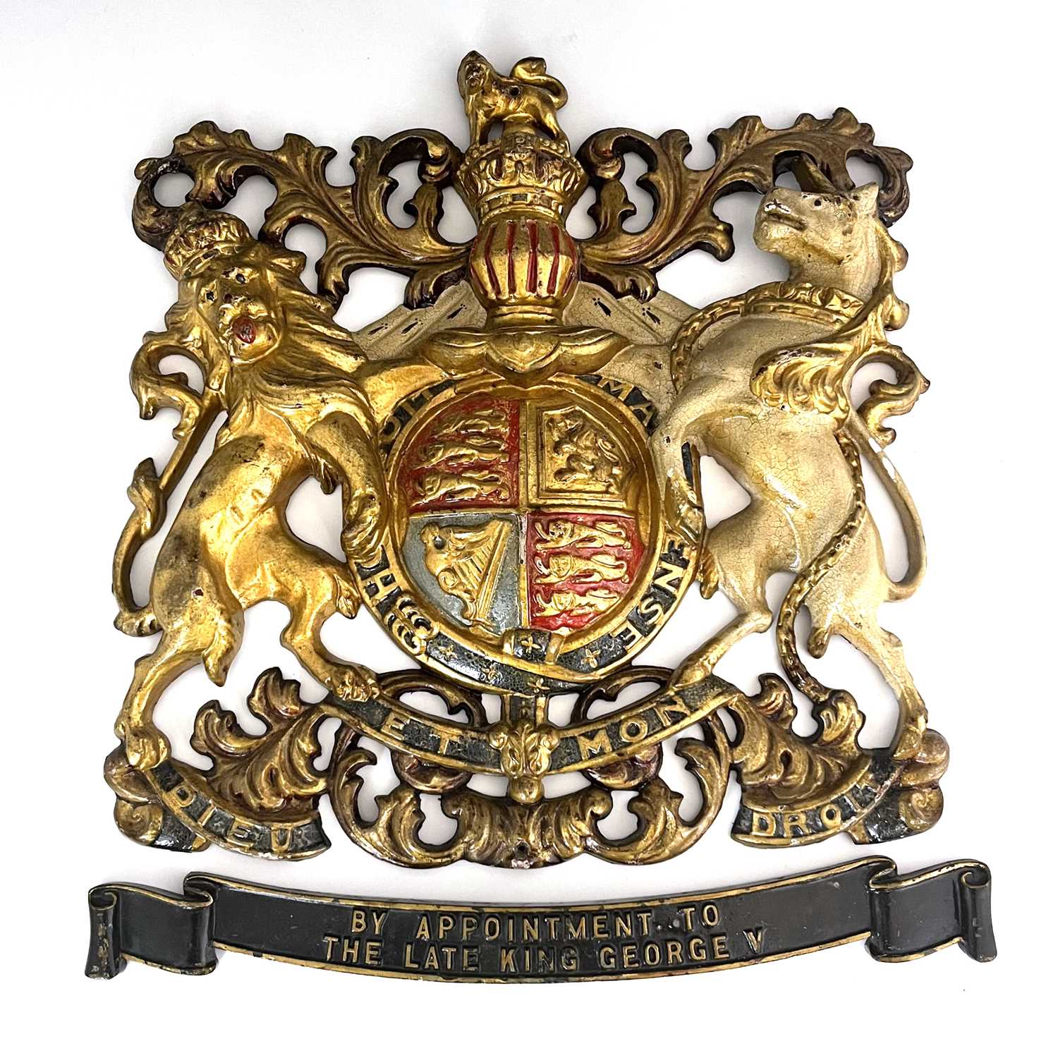 Lot 215 - A cast iron and enamelled Royal Warrant,...