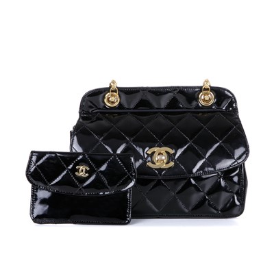 Lot 318 - Chanel, a vintage patent leather handbag with...