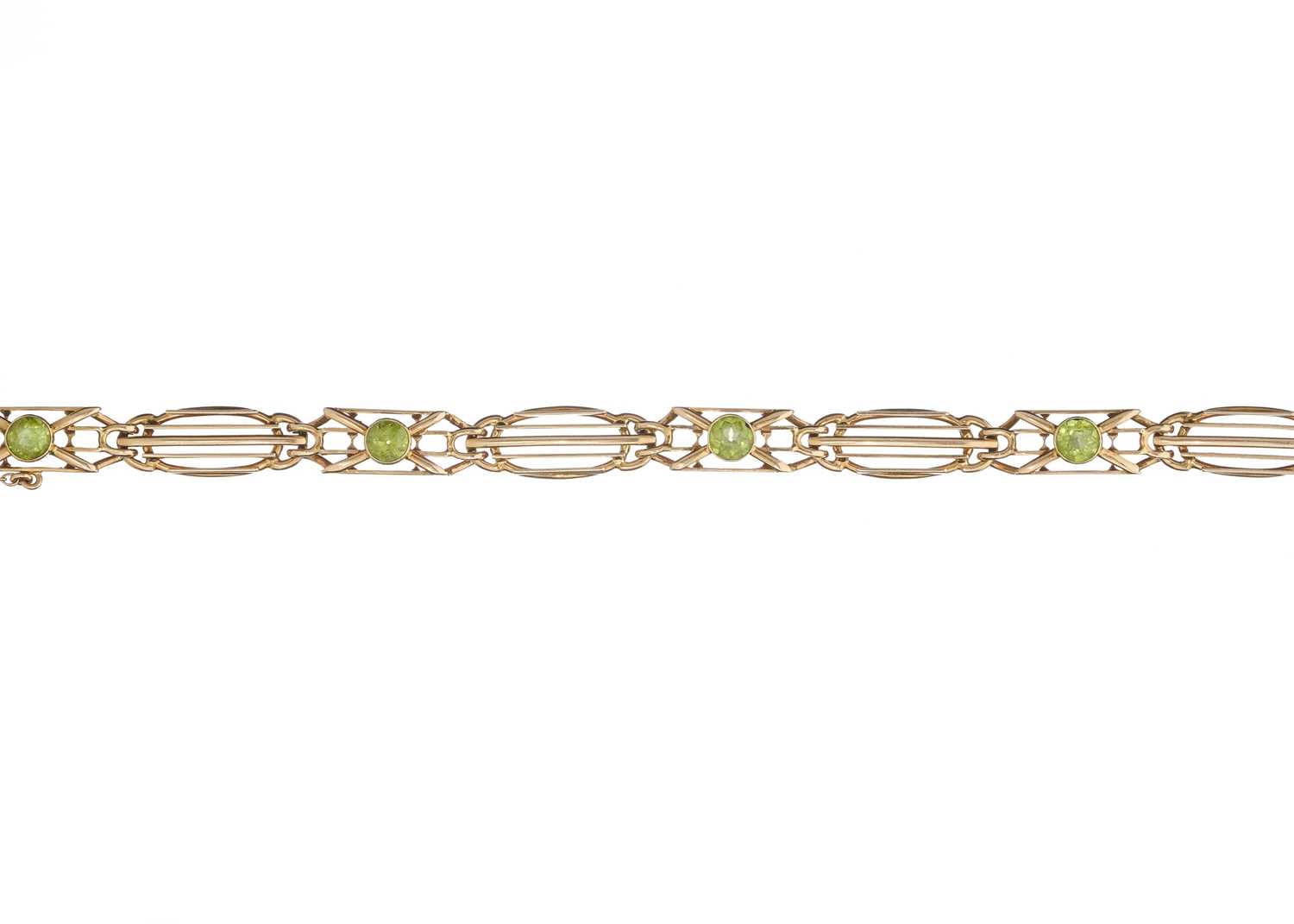 Lot 105 - An Art Nouveau 15ct gold peridot openwork bracelet