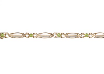 Lot 105 - An Art Nouveau 15ct gold peridot openwork bracelet