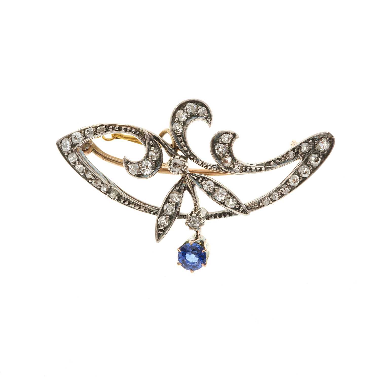 Lot 16 - An Art Nouveau diamond and sapphire foliate brooch