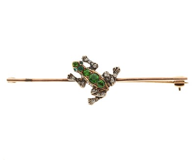 Lot 183 - A 19th century demantoid garnet, emerald and diamond frog bar brooch