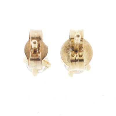 Lot 54 - A pair of 18ct gold diamond single-stone stud earrings