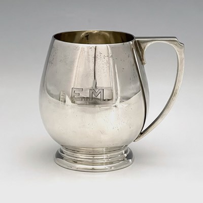 Lot 332 - A George V silver Art Deco mug, the flared...