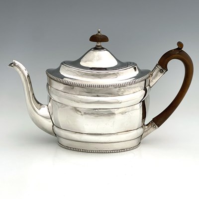 Lot 378 - A George III silver teapot, of oval form with...