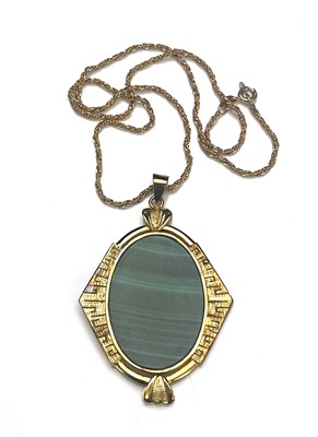 Lot 22 - A silver gilt malachite pendant, with gold chain