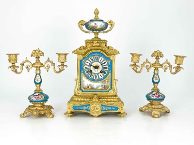 Lot 549 - A French porcelain and ormolu mounted clock...