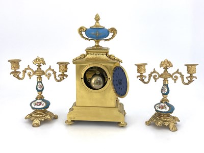 Lot 549 - A French porcelain and ormolu mounted clock...