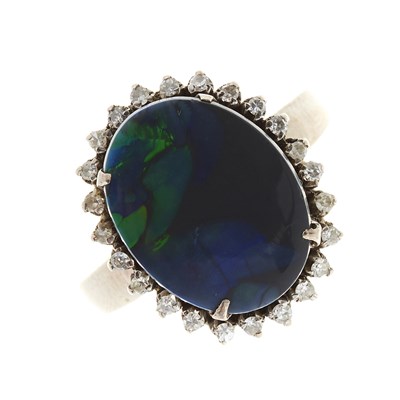 Lot 120 - A mid 20th century 18ct gold black opal doublet and diamond cluster ring