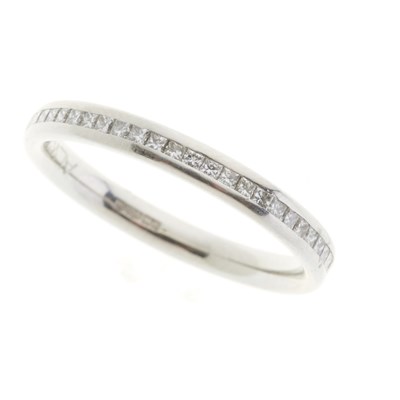 Lot 210 - A platinum diamond half eternity ring