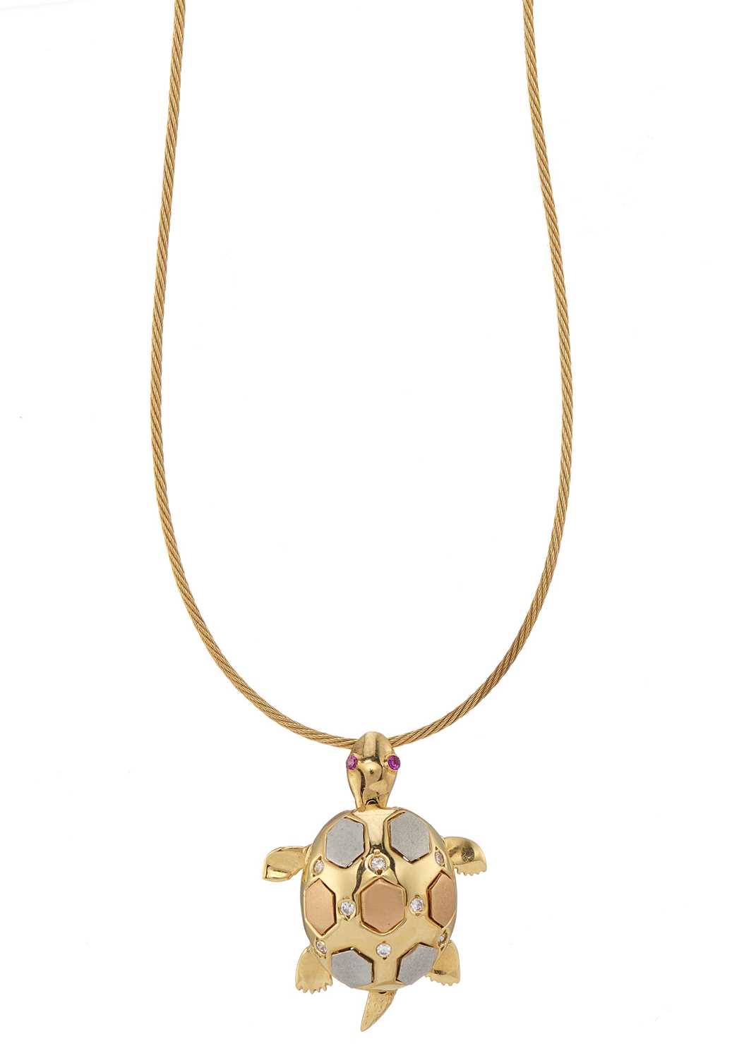 Lot 61 - An 18ct gold diamond and pink sapphire turtle pendant, with chain