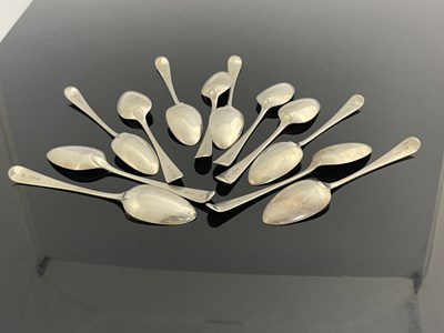 Lot 41 - A set of twelve George III silver table spoons,...