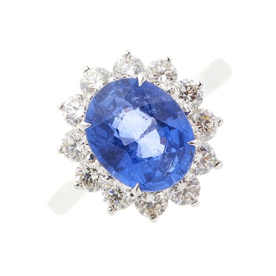 Lot 63 - An 18ct gold sapphire and diamond cluster ring
