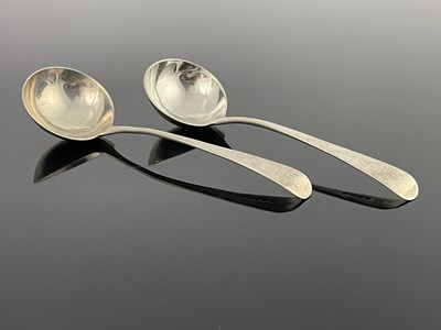 Lot 34 - A pair of George III silver suace ladles,...