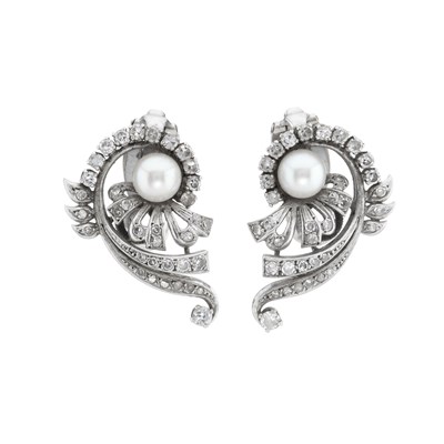 Lot 113 - A pair of mid 20th century pearl and diamond swirl clip earrings
