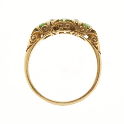 Lot 101 - An Edwardian 18ct gold demantoid garnet and diamond dress ring