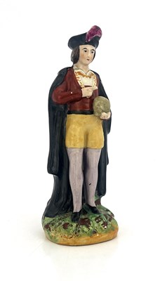 Lot 1034 - A Staffordshire figure of Hamlet, mid 19th...