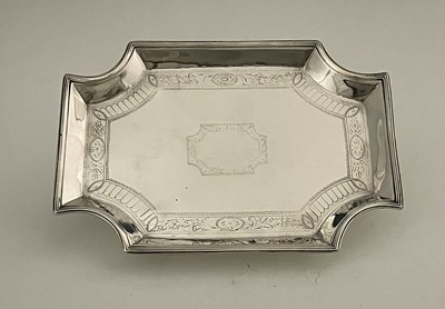 Lot 393 - A George III silver teapot stand, of shaped...