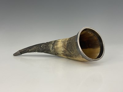 Lot 400 - A Victorian silver-mounted carved horn, the...