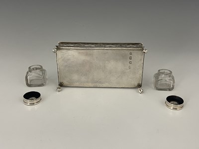 Lot 44 - A George II silver two-bottle inkstand or desk...