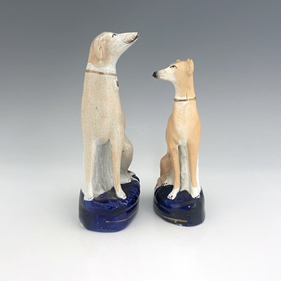 Lot 1024 - Two Staffordshire pearlware greyhounds, circa...