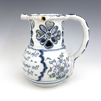 Lot 996 - A Liverpool Delft puzzle jug, bulbous form...