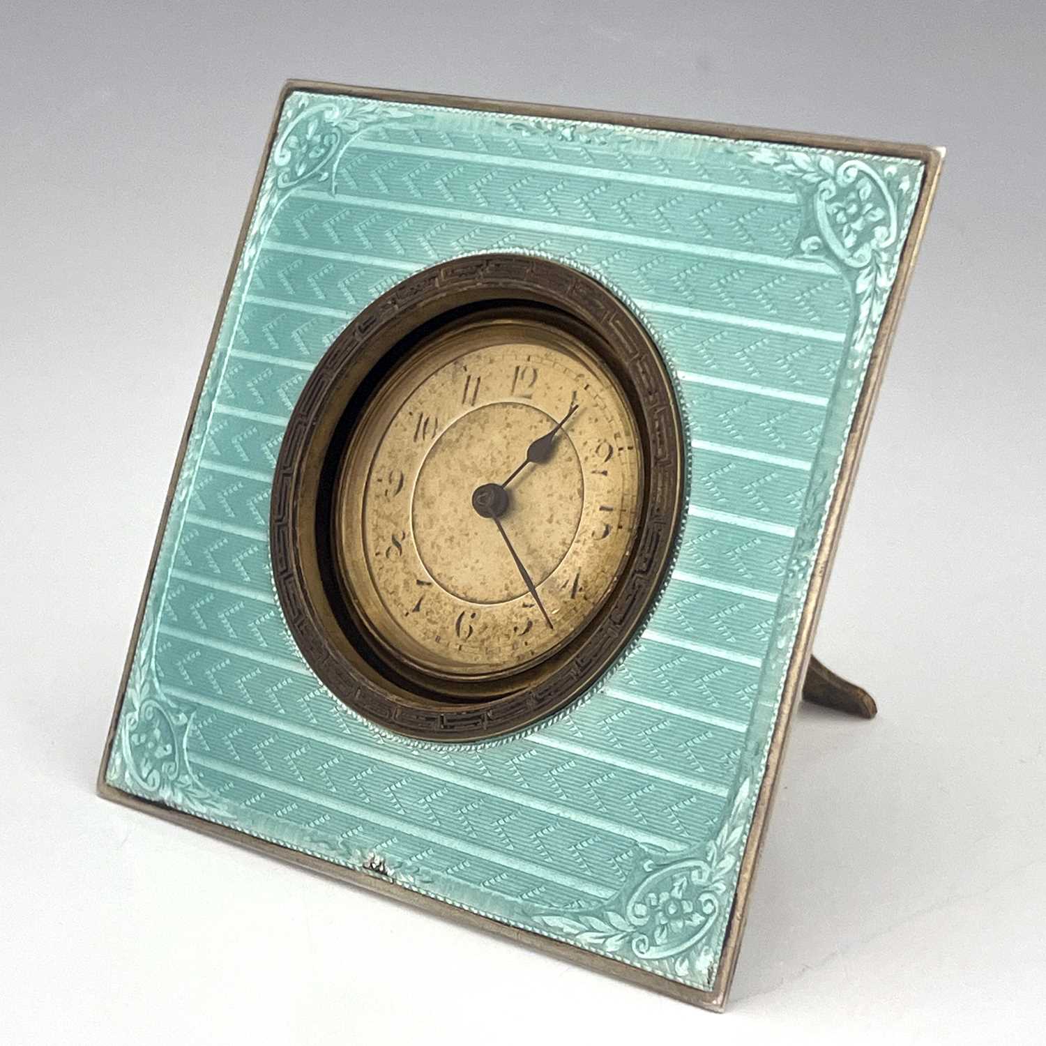 Lot 108 - An Art Deco silver and enamelled clock,...