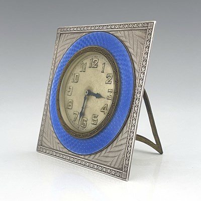 Lot 109 - An Art Deco silver and enamelled clock, Turner...