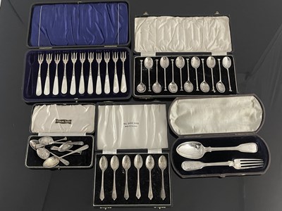 Lot 445 - A group of five cased silver flatware sets to...