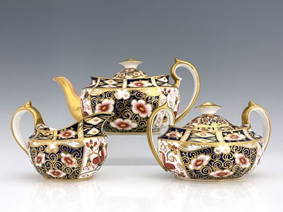 Lot 928 - A Royal Crown Derby Imari 2451 pattern three...