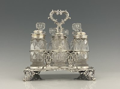 Lot 457 - A William IV silver seven-bottle cruet stand,...