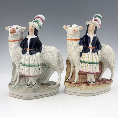 Lot 1039 - A pair of Staffordshire figures of royal...