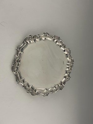 Lot 463 - An Edwardian silver salver, with Rococo scroll...