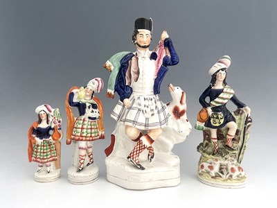 Lot 1030 - Four Staffordshire figure groups, circa 1850,...