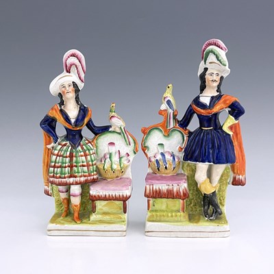 Lot 1069 - A pair of Staffordshire pottery figures, circa...