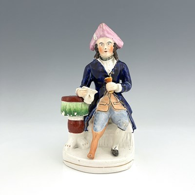 Lot 1061 - A Staffordshire figure of a Greenwich Hospital...