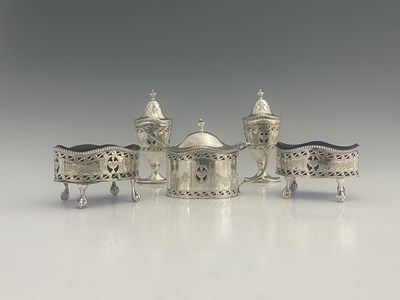 Lot 476 - A George V silver five-piece silver condiment...