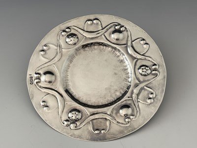 Lot 90 - An Arts and Crafts silver broad rimmed dish,...