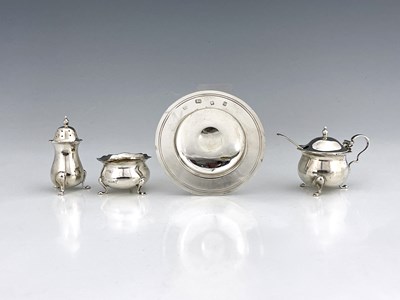 Lot 486 - A George V silver three-piece cruet set,...