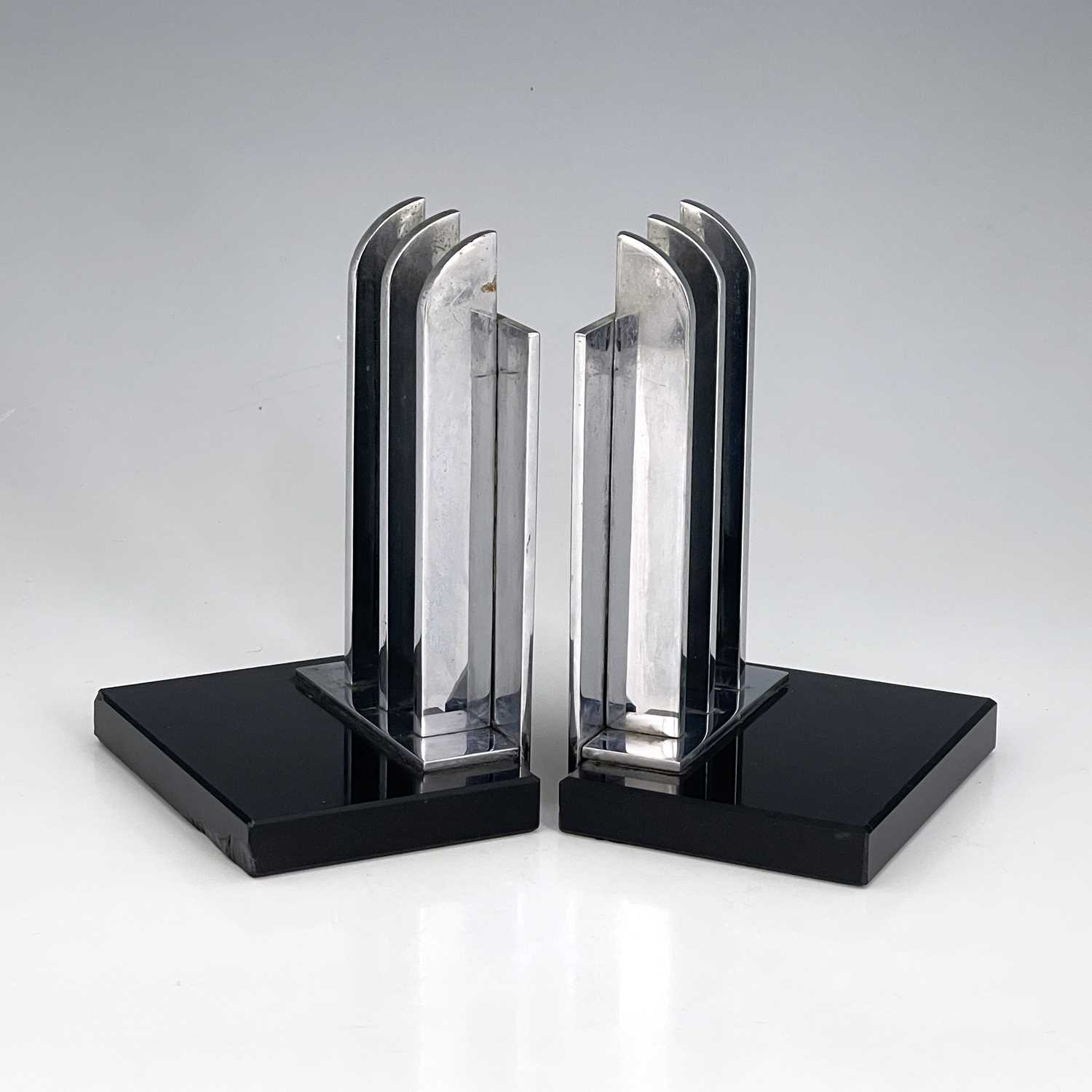 Lot 168 - A pair of Art Deco chrome and black glass...